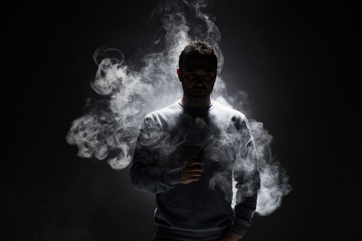 Man and Smoke fragments on a black background