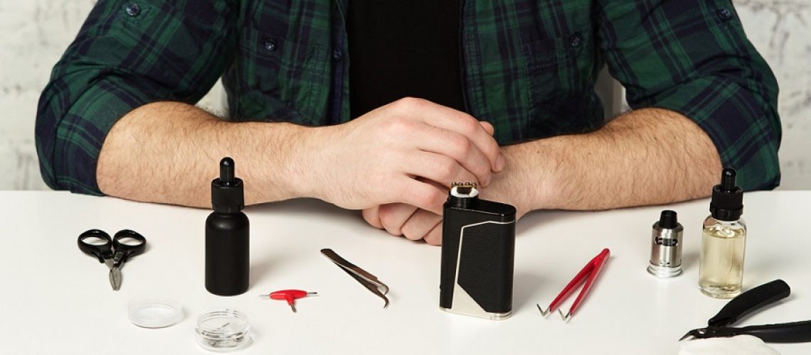 Master repair ecigarette on the white table