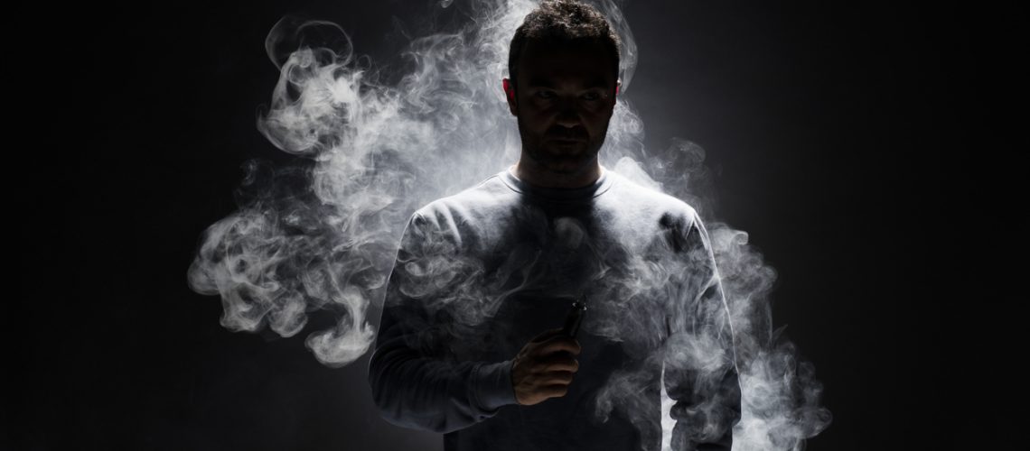 Man and Smoke fragments on a black background